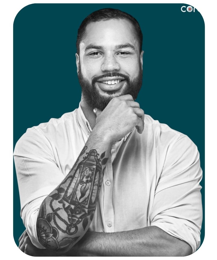 Man smiling with hand on his chin